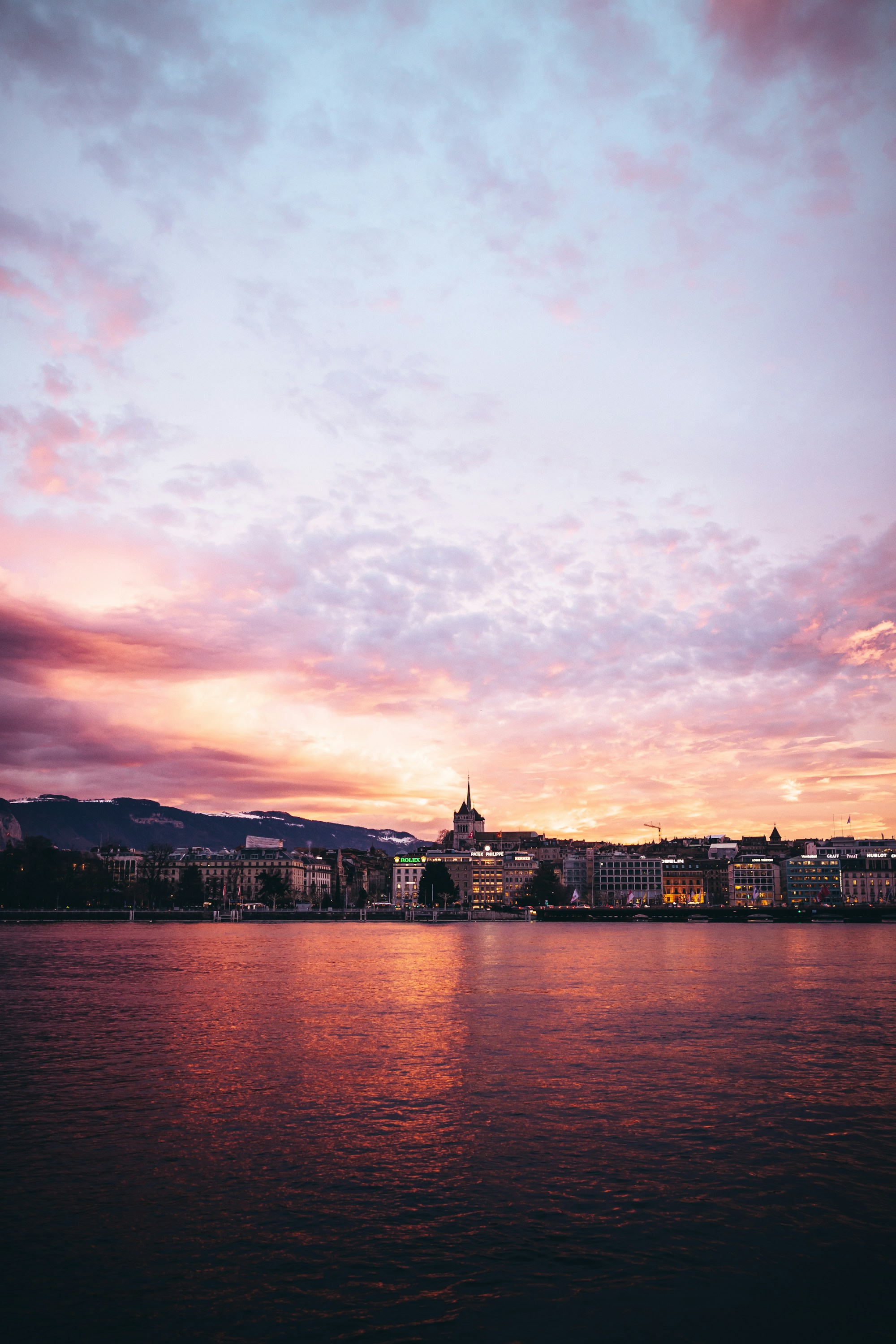 A panoramic view of Geneva’s waterfront at sunset